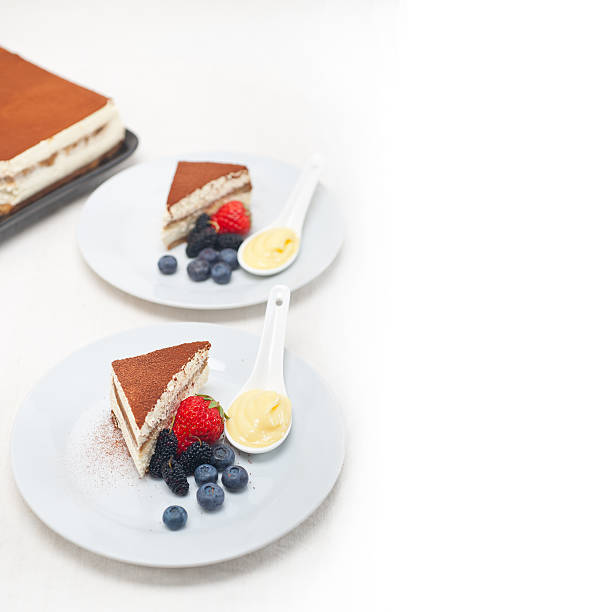 istock tiramisu dessert with berries and cream 178041982