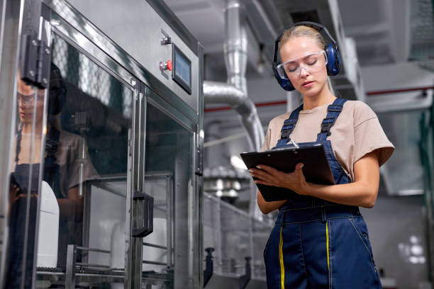 istock engineer checking robotic line for bottling and packaging pesticides into canisters, take notes 1780420771