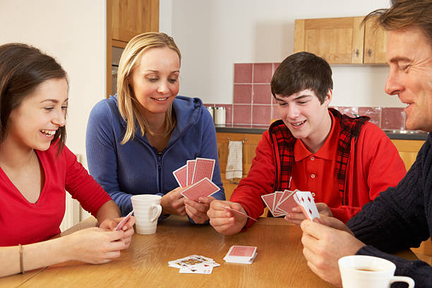 istock Family Playing Cards In Kitchen 178042173