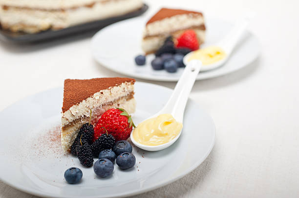 istock tiramisu dessert with berries and cream 178042556