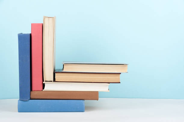 istock Open book, hardback colorful books on wooden table. Back to school. Copy space for text. Education business concept. 1780426177