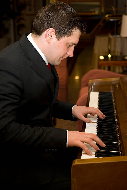 istock Musician playing the piano 178043056