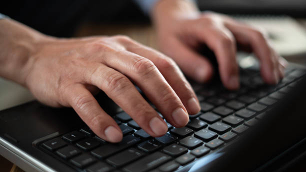 istock Close-up Senior man using laptop at home 1780430999