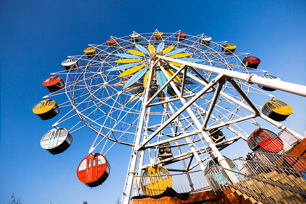 istock Colorful ferris wheel and blue sky 178043467