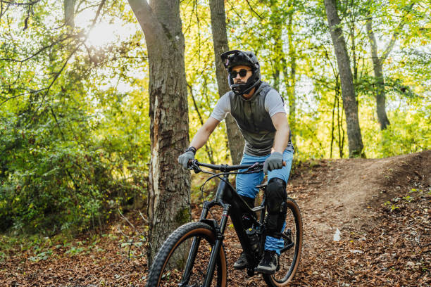istock Man riding mountain bike on a forest trail 1780435791