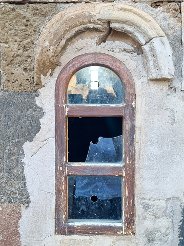Smashed Glass Window of Derelict Abandoned Historic Building,Church on Akdamar Island (Lake Van, Turkey)