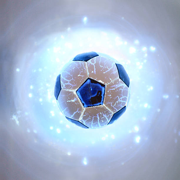 istock Glowing football ball on blue background 178044112