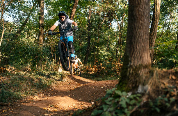 istock Mountain biker jumping and performing aerial maneuvers 1780442031