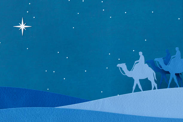 Christmas christian nativity scene with wiseman guided to the baby Jesus in a manger.