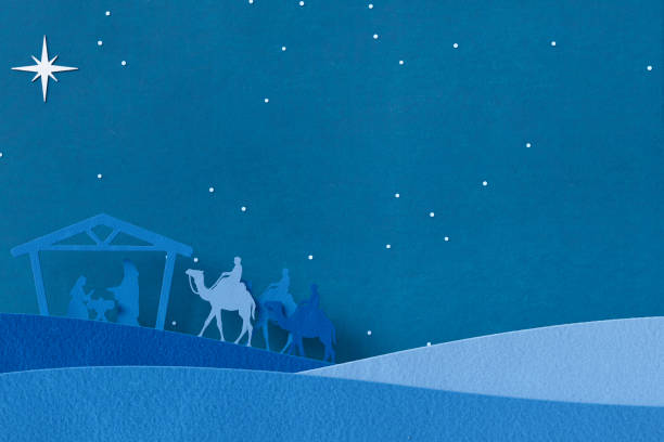 Christmas christian nativity scene with wiseman guided to the baby Jesus in a manger.