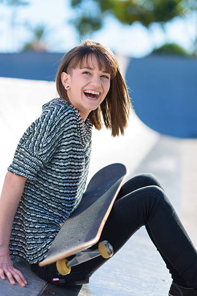 istock Happy Woman Sitting With Skateboard 178045450
