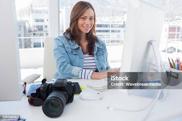 Smiling Photo Editor Working On Computer Stock Photo - Download Image Now - 30-39 Years, Adult, Adults Only