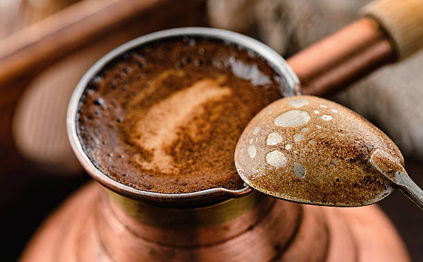 Fresh coffee in the pot and a spoon stock photo