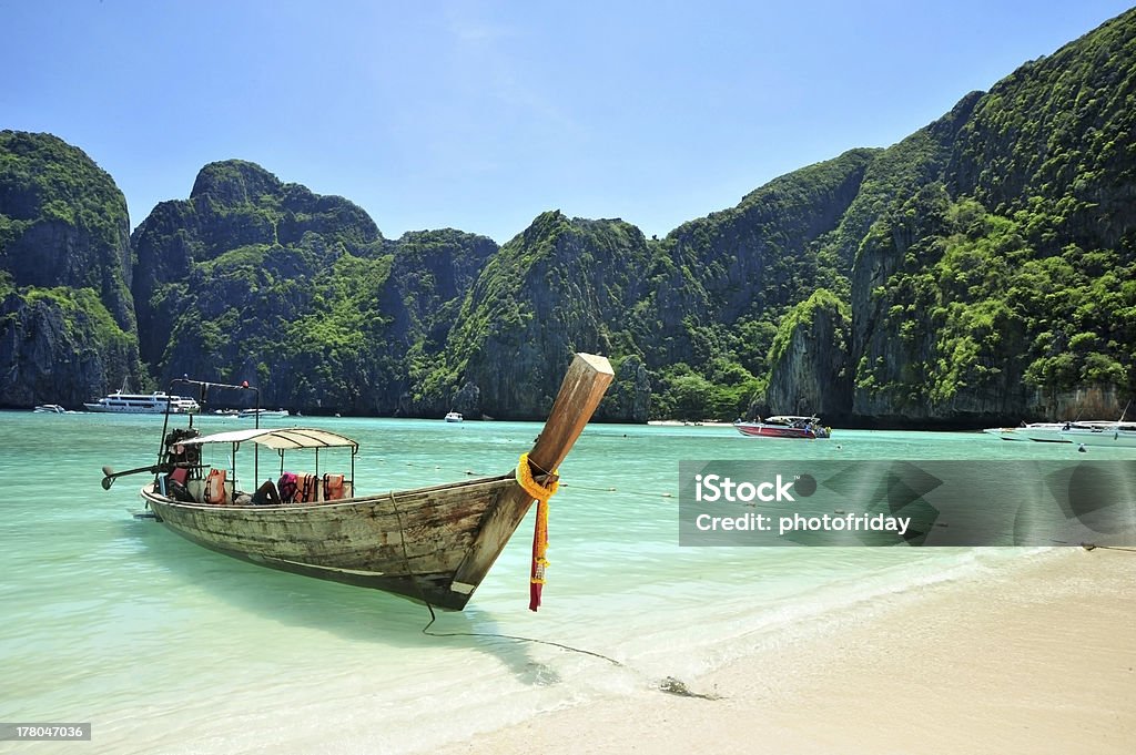 Andaman Sea in Thailand Traditional longtail boats in the famous Maya bay of Phi-phi Leh island, Krabi province, Thailand Andaman Sea Stock Photo