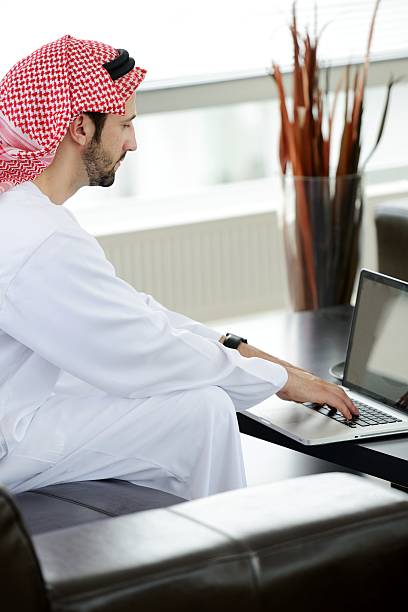 istock Portrait of a smart arabic business man using laptop 178047383