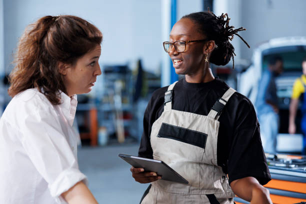 istock Expert informs client of car motor costs 1780475912