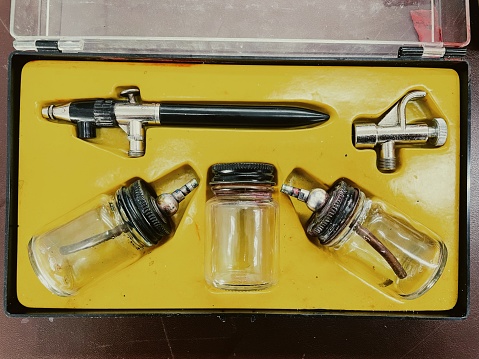 Components of old airbrush painting equipment