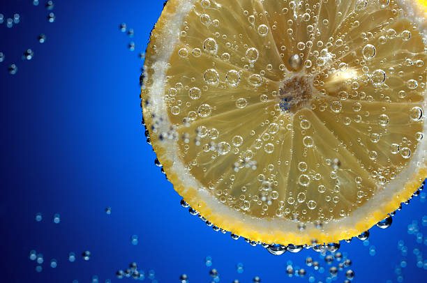 istock Slice of fresh lemon in water with air bubbles 178048098