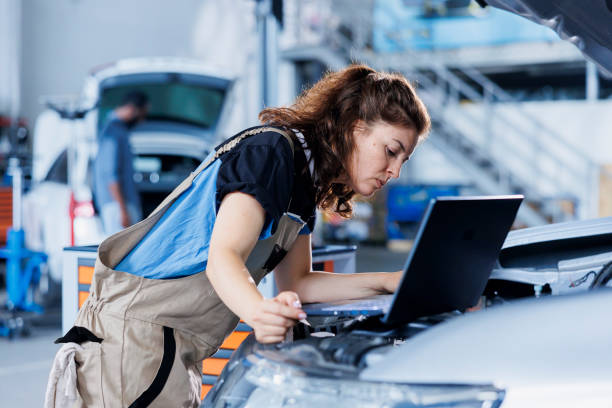 istock Expert follows car checklist on laptop 1780481308