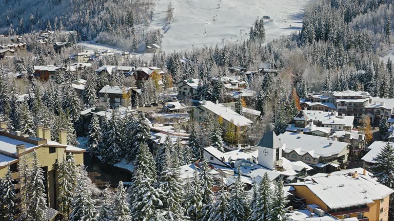 Drone Flight Past Clock Tower Towards Ski Slope in Vail, CO