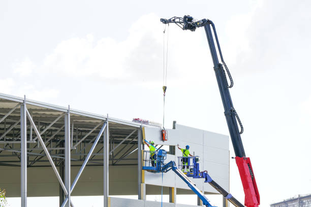 Sandwich panels wall assembly using telescopic boom crane and two self propelled articulating lifts Sandwich panels wall assembly using telescopic boom crane and two self propelled articulating boom lifts, sandwich panels wall mounting sandwich panel photos stock pictures, royalty-free photos & images