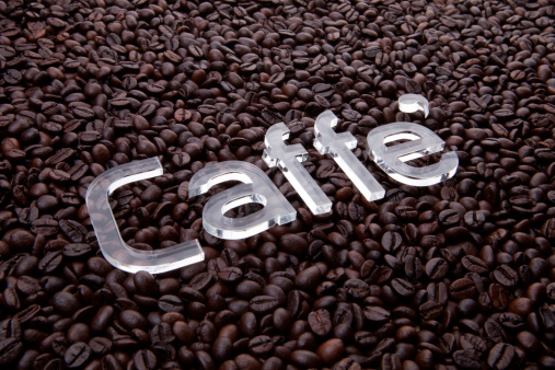 caffe text on coffee beans background