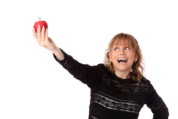 istock Woman showing a red apple 178049552