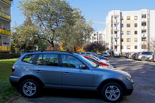 Warsaw, Poland - October 30, 2023: Parked cars in a local car park in the housing estate of Goclaw in the district of Praga-Poludnie.