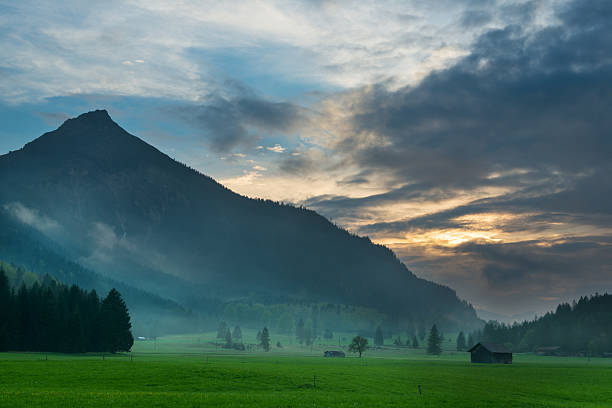 istock mystic hut in mountain meadow 178050723