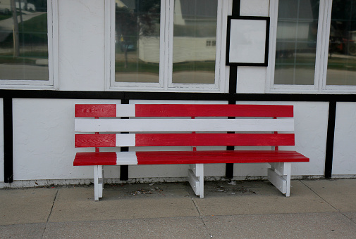 Wooden Bench with Danish Flag Paint in front of Building  in Silkeborg, Denmark