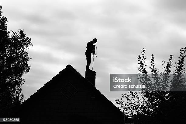 Chimney Sweeper Working On The Roof Stock Photo - Download Image Now - Chimney Sweep, Service, Cleaning