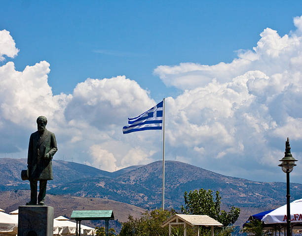 Greece flag and statue on a sky Greece flag and statue on a sky, Kefalonia - Greece lixouri stock pictures, royalty-free photos & images