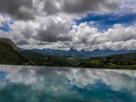 Swimming Pool at The Mountain. Mountains reflect in the water of the pool.