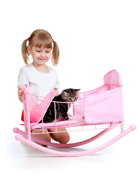 istock child girl playing with kitten 178052479