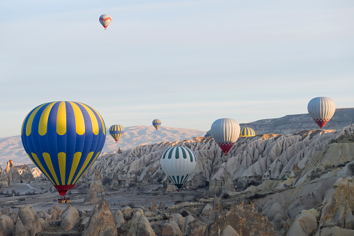 Colorful hot-air balloons flying over the mountain