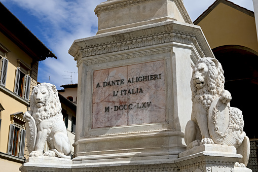 Florence, Italy - April 14, 2023: Pedestal with an inscription reading Dante Alighieri. The base of the monument to Dante Alighieri in Piazza Santa Croce, in the historic centre of the city.