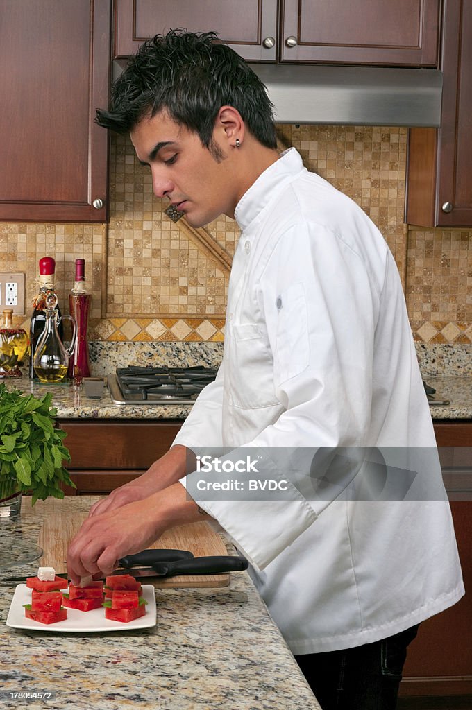 chief chef preparing appetizer with watermelon, feta cheese and mint Adult Stock Photo