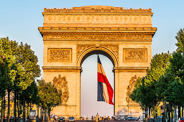 arc of triumph with the french flag paris city France stock photo