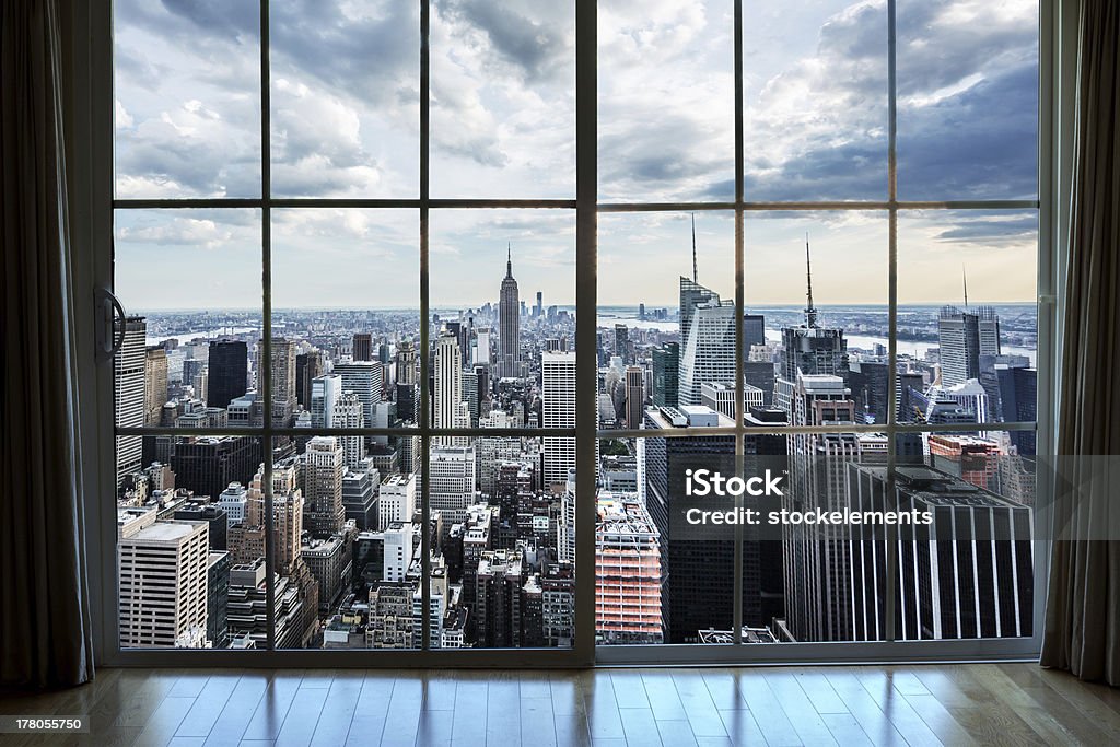 Real Estate View Manhattan NYC Window Empire State Building view of Manhattan from high rise window Apartment Stock Photo