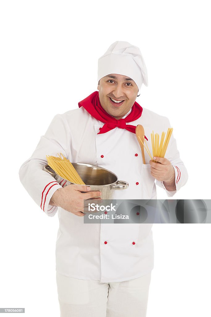 smiling cook man holding pan filled with raw macaroni smiling cook man holding pan filled with raw macaroni wearing white uniform in the studio over white background Adult Stock Photo