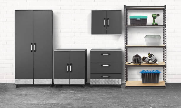 Group of tool chest and cabinets in a garage with white brick wall