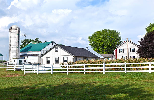 istock farm house with field and silo 178057066