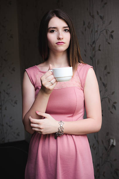 istock Calm young woman with a cup of coffee 178057193