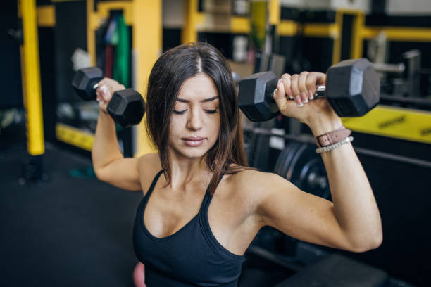istock Woman training with dumbbells 1780587356