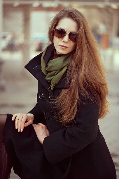 istock Beautiful woman in an elegant black coat 178059324