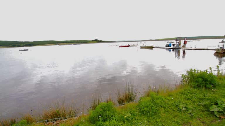 Video, boats on lake or reservoir.