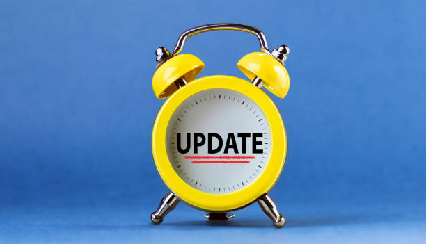 istock Update concept. Time to update message in yellow alarm clock on blue background. 1780593875
