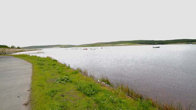 Video, boats on lake or reservoir.