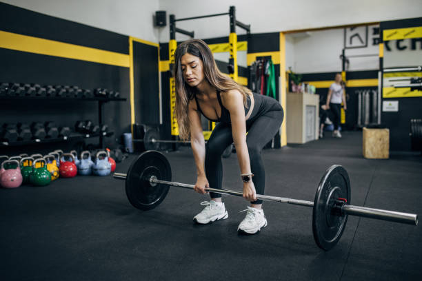 istock Fit woman weightlifting in gym 1780593880