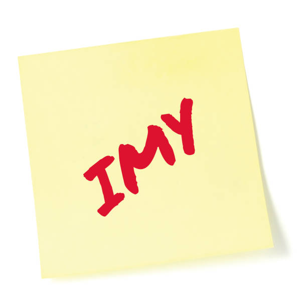 istock I miss you texting acronym IMY, wistful longing textspeak text concept, red marker romance crush slang message metaphor, isolated yellow adhesive post-it sticky note abbreviation sticker, large detailed macro closeup 1780596119